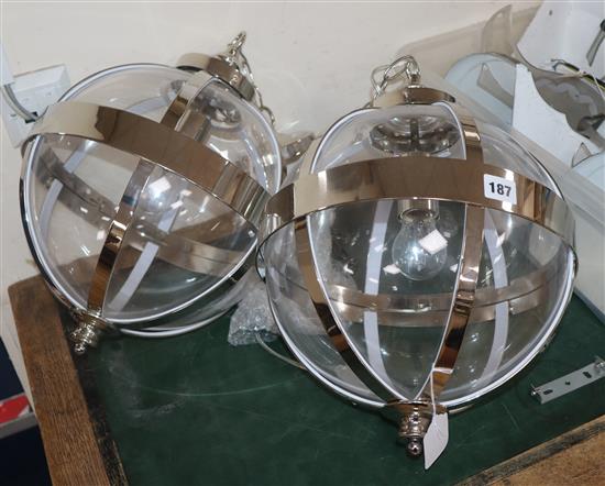 A pair of Laura Ashley contemporary glass and chrome spherical ceiling lights